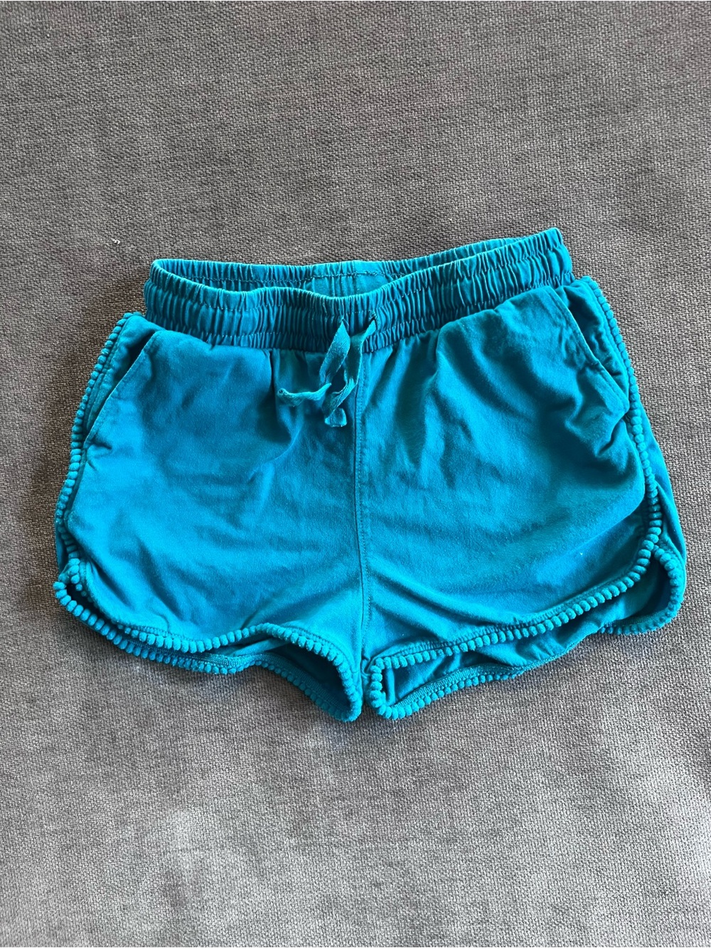 Tea Collection girl's pom-pom shorts in Viridian size 7
